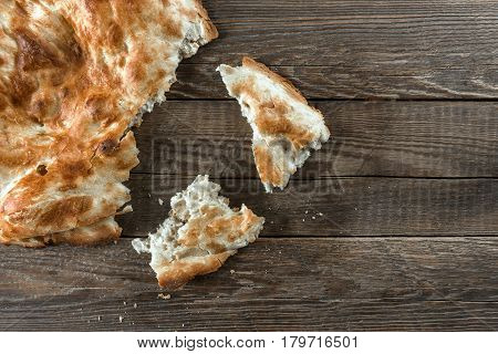 Traditional asian bread. Flatbread on wooden background