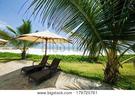 view of nice exotic bamboo hut on tropical beach