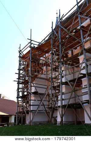Reconstruction Of The Old Fortified Medieval Saxon Church In Dirjiu, Transylvania, Romania. Scaffold