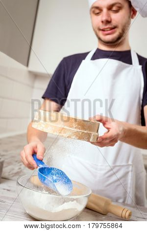 Portrait Of A Male Chef Cook Praparation Pastry On A Kitchen