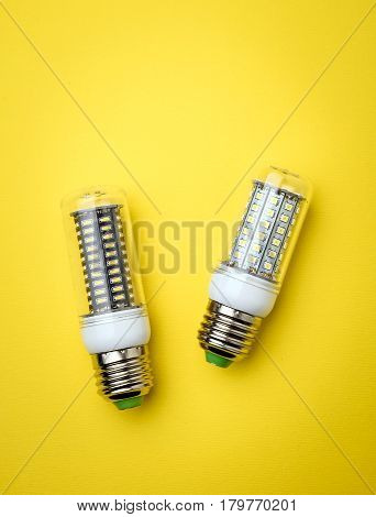 Energy Saving Led Light Bulb On A Yellow Background With Empty Space