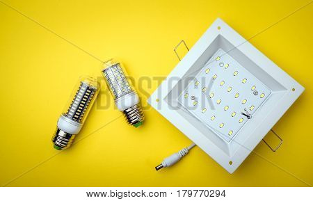 Energy Saving Led Light Bulb On A Yellow Background With Empty Space