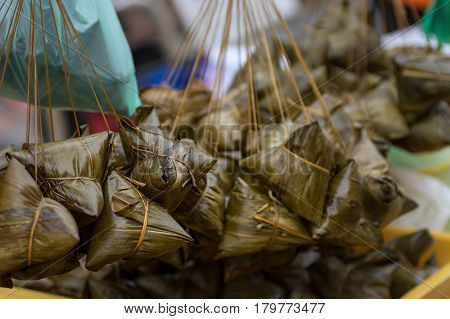 Siew Bak Chang, Glutinous Rice And Pork Wrapped In Banana Leaf Parcels For Sale.
