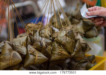 Siew Bak Chang, Glutinous Rice And Pork Wrapped In Banana Leaf Parcels For Sale.