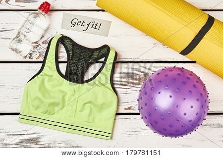 Tank top and ball. Enjoy active life.