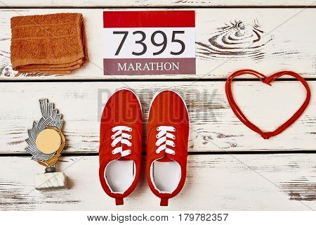 Towel, keds, shoelaces and reward. Opening new sport horizons.
