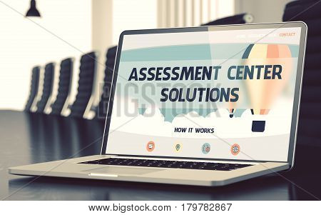 Assessment Center Solutions on Landing Page of Laptop Screen. Closeup View. Modern Meeting Room Background. Blurred Image with Selective focus. 3D.