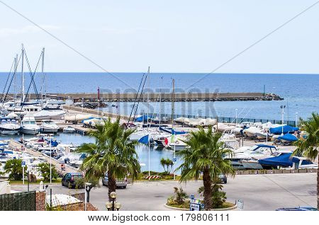 yacht boat and Fishing boats in a harbor on sardegna island in italy