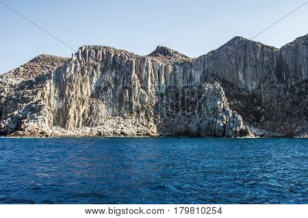 Blue sea and characteristic caves of Cala Luna Golfo di Orosei Sardegna or in Sardinia Italy