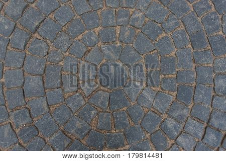 Gray paving stone paved with a pattern circule