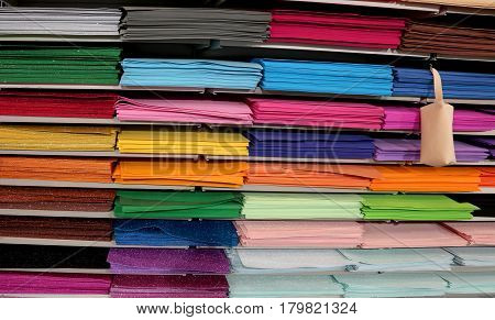 many pieces of glittery fabric and felt cloth for sale in female hobby shop