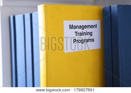 Book of MANAGEMENT TRAINING PROGRAMS on shelf