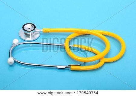 RX prescription, Red heart, asorted pils and a stethoscope on white background.