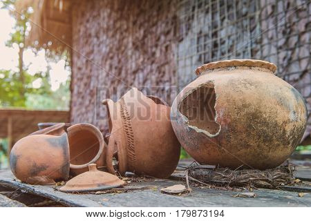 Broken Antique Clay Pot Or Traditional Jar On Abandoned Hut