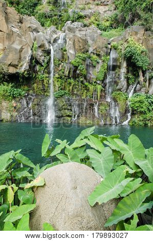 Saint Gilles (La Reunion) France - 9 January 2003: people sunbathing on the Cormorans waterfall at Saint Gilles on Reunion island France