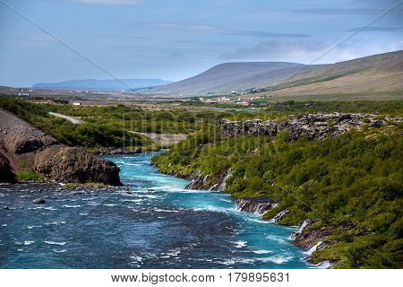 Hraunfossar Series Of Waterfalls Formed By Rivulets Streaming Over A Distance Of About 900 Metres