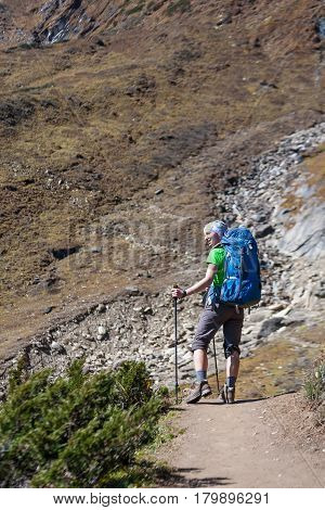 Trekker in front of Manaslu glacier on Manaslu circuit trek in Nepal