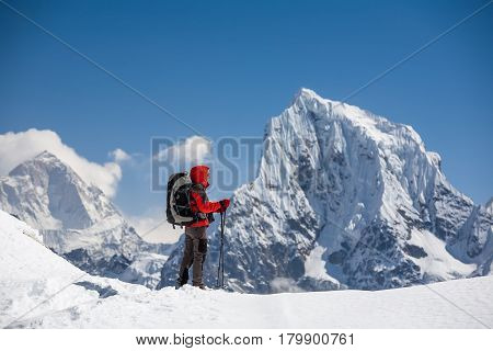 Trekker Is Walking By Renjo La Pass In Everest Region