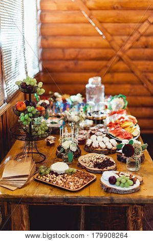 Candy Bar. Delicious sweet buffet with cupcakes. Sweet holiday buffet with cupcakes and other desserts.Table with sweets, candies, dessert