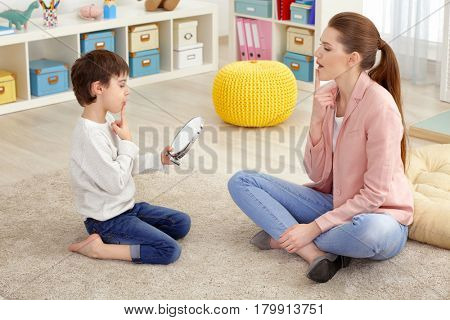 Cute little boy at speech therapist office