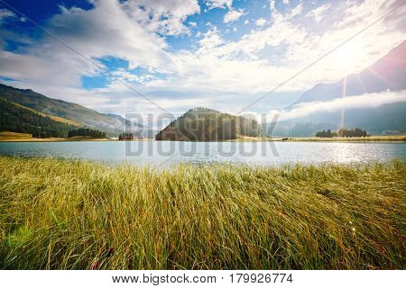 Azure pond Champfer is a unique place on earth. Picturesque day and gorgeous scene. Location Silvaplana village, Swiss alps, Maloja, Europe. Wonderful image of wallpaper. Explore the world's beauty.