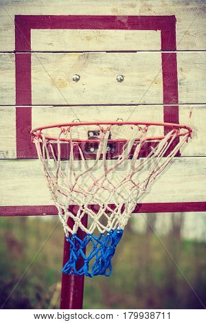 Sport recreation outside concept. Closeup of old vintage wooden basketball board outdoor