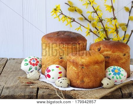 Easter Composition Of Sweet Bread, Paska And Eggs On Wooden Background. Orthodox Kulich. Holidays Br