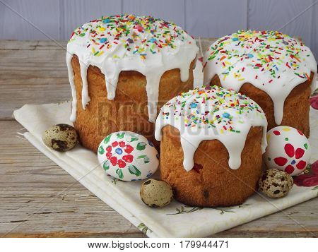 Easter Composition Of Sweet Bread, Paska And Eggs On Wooden Background. Orthodox Kulich. Holidays Br