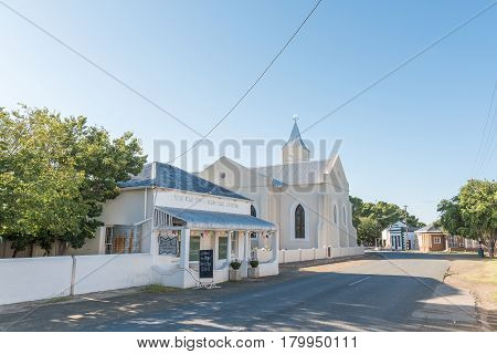 PHILIPPOLIS SOUTH AFRICA - MARCH 21 2017: A street scene with the Dutch Reformed Church and a museum in Philippolis the oldest town in the Free State Province