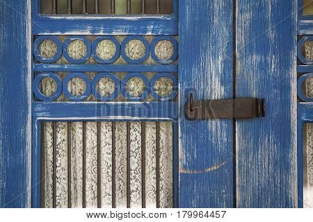 old wooden blue door in Tulum Mexico