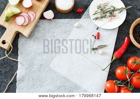 Composition of green and red vegetables on a dark background with space for text. Good for advertising posters and magazines.
