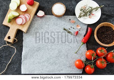 Composition of green and red vegetables on a dark background with space for text. Good for advertising posters and magazines.