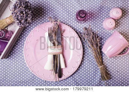 Rustic lavender table serving - dry flowers and lilac dishware