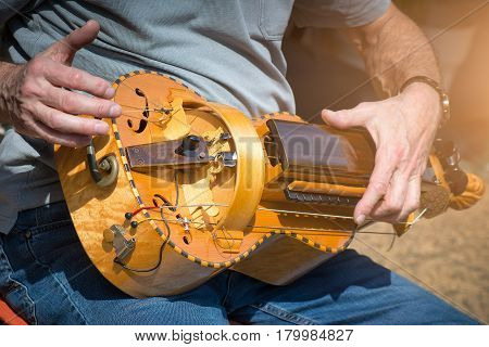 Hurdy Gurdy Man player ioutdoor street city
