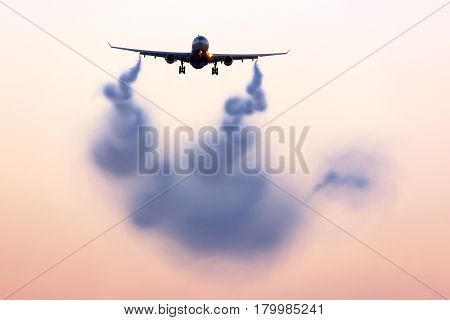Turbulent wake visualizing behind airplane against sunset sky on background