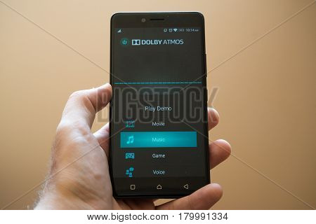 Nitra, Slovakia, March 24, 2017: Dolby Atmos application logo on smartphone