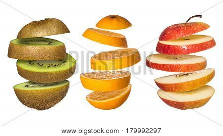 Set os Flying fruits. Sliced orange, kiwi, apple isolated on white. Levity fruit floating in the air