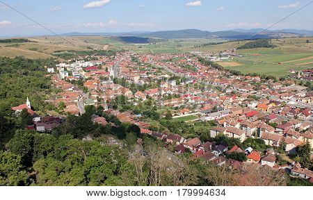 Top view of an village with the church in the center.