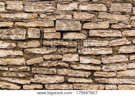 Remnants of an ancient fortress wall. Former city fortifications in the north-west of Russia. Pskov sity. Texture or background.