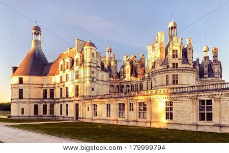 The royal Chateau de Chambord at sunset, France. This castle is located in the Loire Valley, was built in the 16th century and is one of the most recognizable chateaux in the world.