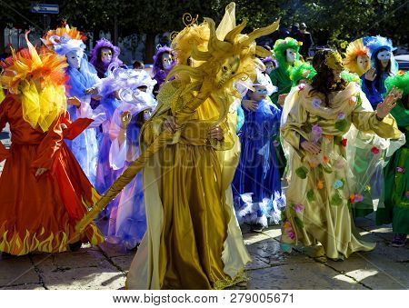 Modugno, Italy - February 4, 2018: Young People And Children With Beautiful And Colorful Clothes Dur