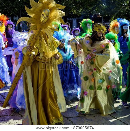 Modugno, Italy - February 4, 2018: Young People And Children With Beautiful And Colorful Clothes Dur