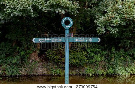 A Green Cycle Sign On The Towpath Along The Leeds Liverpool Canal