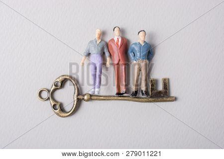 Tiny Figurine Of Man Miniature And Retro Key