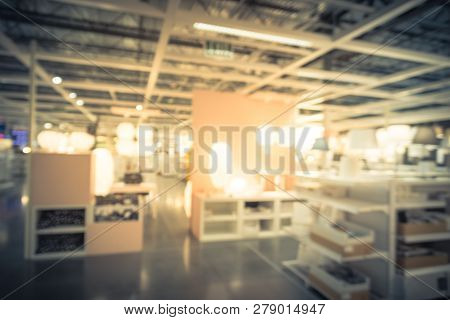 Blurry Background Variety Of Table, Ceiling, Floor Lamps At Furn