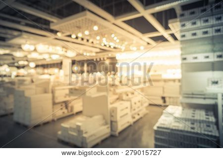 Blurry Background Variety Of Table, Ceiling, Floor Lamps At Furn