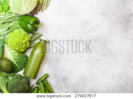 Assorted Green Toned Raw Organic Vegetables On White Stone Background. Avocado, Cabbage, Cauliflower
