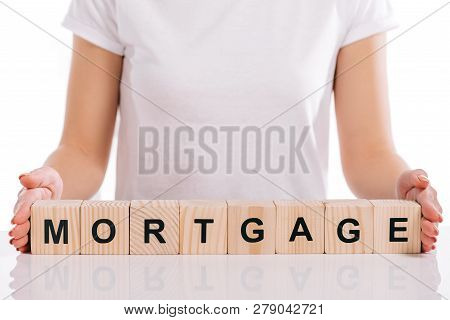 Cropped View Of Woman Holding Wooden Cubes With Mortgage Lettering Isolated On White