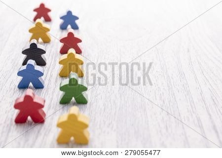 White Wooden Figure In The Shape Of A Man Stands On Other Details. Parts Of The Board Game.