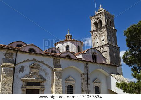 Ancient Church Of The Holy Cross ( Timios Stavros ) Outside Against The Blue Sky. Mountain Village P